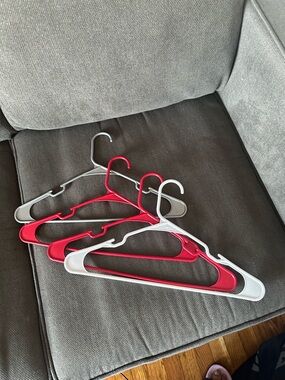 Set of Red and White Plastic Clothes Hangers